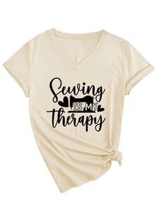Detail of V-neck T-shirt showing Sewing is my therapy print and stylish side knot design