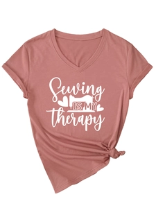 Detail of V-neck cotton T-shirt featuring a sewing machine print and stylish knotted hem