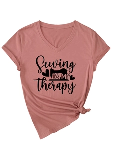 Detail of V-neck T-shirt in dusty pink featuring a sewing machine slogan print