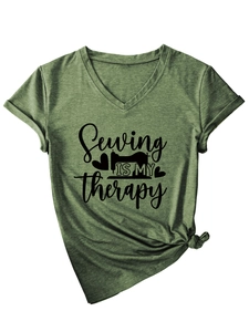 Detail of Sewing Is My Therapy slogan and sewing machine print on green V-neck cotton T-shirt