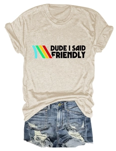 Detail of beige round neck t-shirt with Dude I Said Friendly print and ripped denim shorts