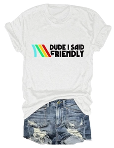Detail of white cotton t-shirt with 'Dude I Said Friendly' print and distressed denim shorts