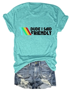 Flat lay of lake green t-shirt with Dude I Said Friendly text and denim shorts