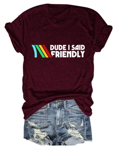 Detail of burgundy T-shirt with 'DUDE I SAID FRIENDLY' print and rolled sleeves