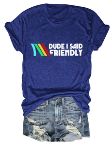 Flat lay of navy blue graphic tee with denim shorts set featuring frayed hems and vintage wash