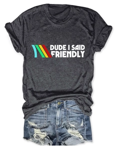 Flat lay of gray graphic t-shirt with slogan and distressed blue denim shorts set