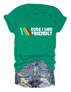 Green t-shirt with 'Dude I Said Friendly' print and distressed denim shorts layout