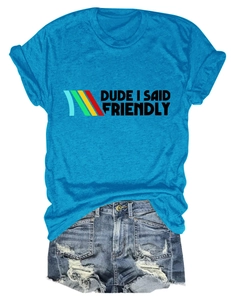 Flat lay of blue cotton t-shirt with slogan text and distressed denim shorts with fringe