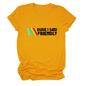 Close-up of retro DUDE I SAID FRIENDLY text and color stripes on ginger yellow T-shirt