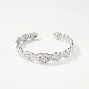 Detailed shot of silver adjustable open bangle with unique hammered fold texture