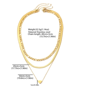 Detailed view of triple-layered golden stainless steel necklaces with heart pendant