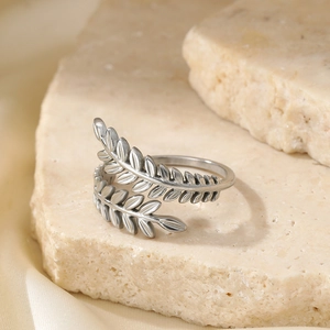 Vintage silver olive leaf open ring featuring adjustable branches on a stone base