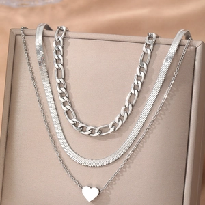 Three-layer silver layered necklace set with Figaro chain, snake chain and heart pendant