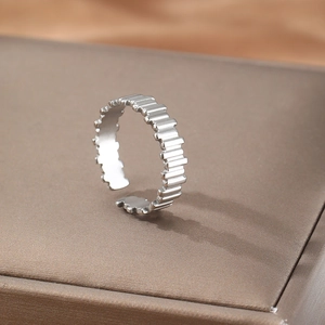Minimalist silver open ring with geometric jagged edges in polished stainless steel finish