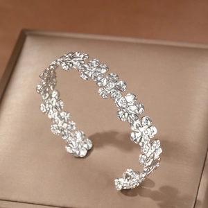 Artistic silver flower open cuff bangle with handcrafted hammered texture for women
