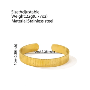 Detailed specs of the 18K gold plated stainless steel cuff with bark texture design