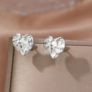 French vintage silver heart stud earrings with ripple texture on velvet jewelry box