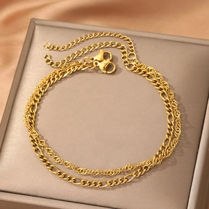 Double-layered gold Figaro and rope chain bracelet with an adjustable lobster clasp