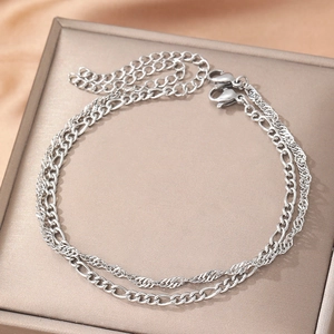 Silver double layer bracelet featuring Figaro and twisted rope chain with lobster clasp