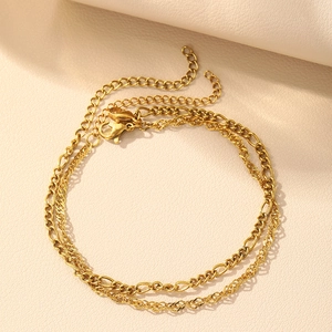 Elegant gold double-layer chain bracelet featuring a twist link design and lobster clasp