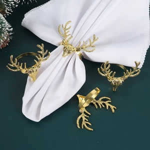 Set of 4 golden reindeer head napkin rings with antlers for festive Christmas table decor