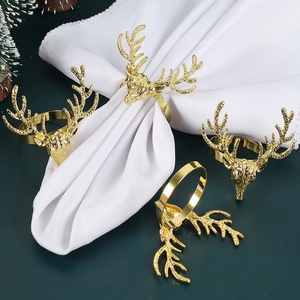 Set of 4 gold reindeer head napkin rings for Christmas table decor, metal antlers design