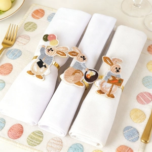 Easter embroidered bunny napkin rings with gold metal bands for festive table setting