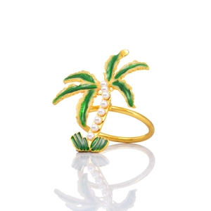 Golden coconut tree napkin ring with green enamel leaves and white pearl trunk detail