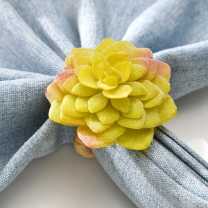 Rustic faux succulent napkin ring with natural grass woven loop for table decor