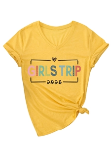Detail of yellow V-neck T-shirt with leopard heart and Girls Trip 2026 print