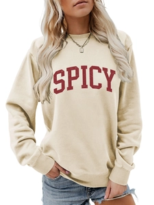 Detail view of cream long sleeve sweatshirt featuring red SPICY varsity letter print