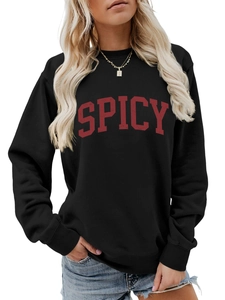 Close-up of the red SPICY lettering on a black casual crewneck sweatshirt fabric