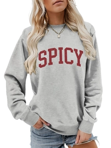 Detail of grey sweatshirt featuring red distressed SPICY lettering and ribbed cuffs