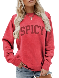 Detail of red crewneck sweatshirt featuring a bold dark red SPICY graphic print