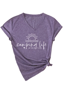 Detail of purple V-neck T-shirt with camping print and stylish knotted hem design