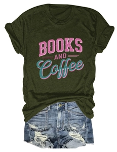 Flat lay of dark green Books and Coffee t-shirt with distressed denim shorts outfit