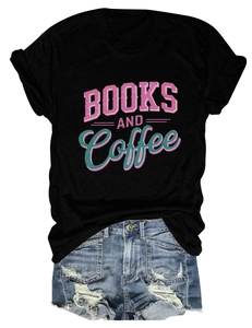 Close-up of Books and Coffee vintage typography on black cotton t-shirt fabric