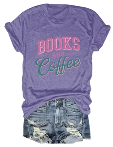 Flat lay of purple cotton T-shirt with 'BOOKS AND COFFEE' text and distressed denim shorts