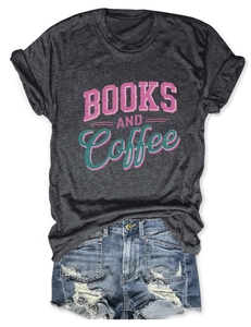Close-up of Books and Coffee graphic tee with distressed denim shorts on white background