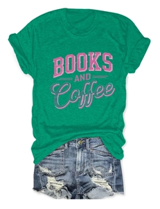 Detail of green T-shirt with BOOKS AND Coffee print paired with frayed denim shorts