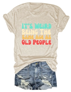 Detailed flat lay of beige crew neck t-shirt with vintage text and denim shorts