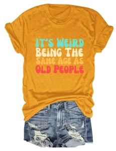 Flat lay of ginger crew neck t-shirt with vintage text print and denim shorts