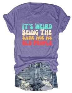 Flat lay of purple slogan T-shirt and distressed denim shorts with fringe details