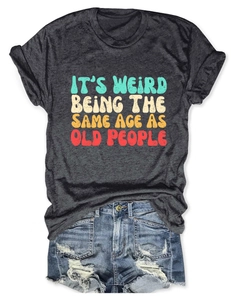 Macro detail of charcoal grey t-shirt fabric with colorful retro graphic text print