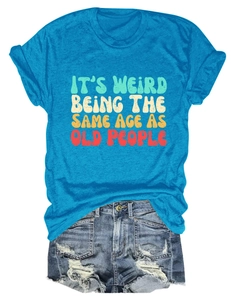 Flat lay of blue cotton t-shirt with vintage slogan and distressed denim shorts outfit
