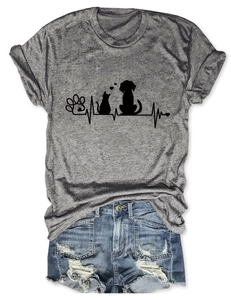 Flat lay of gray heather T-shirt with heart-beat paw print and blue denim shorts