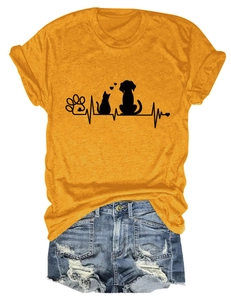 Detail of yellow T-shirt with cat dog paw prints and distressed denim shorts outfit