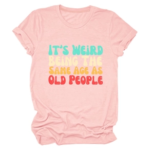 Detail of retro gradient lettering on light pink cotton crewneck t-shirt fabric