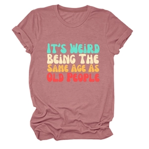 Detail view of pink crewneck T-shirt with vintage colorful text print on cotton fabric