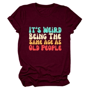 Detail of burgundy cotton T-shirt featuring soft fabric texture and vintage slogan print